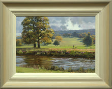 Load image into Gallery viewer, 10 x 14 inch oil of two large Autumn trees on the left middle distance, one human walking and several sheep, a hill rising up to blue distant trees and a lively sky. Shows hand-finished frame with pale colurs to a grey outer frame.
