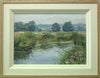 Summer by the River Welland, with hazy blue distant trees, water in the foreground with lily pads floating on the surface. Shows double cream inner frame with plain Oak outer frame