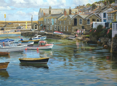 22 x 30 inch oil painting of many boats on the water in Mousehole harbour at high tide, with all the stone houses around the harbour wall and figures talking together.