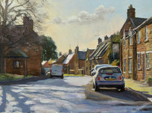 Load image into Gallery viewer, 6 x 8 inch oil of the main street in Lyddington in Rutland, looking into the sunlight, with chimneys silhouetted against the sunlight, with a strong shadow of a tree across the road and a couple of parked cars.
