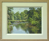 A 9 x 12 inch oil painting of the River Derwent at Ilam Park, with lots of trees in full Spring green leaf, trees in the right foreground and lots of reflections in the clear water, and a single figure walking towards us in the filed in the middle distance. Also shows cream inner frame moulding with plain Oak outer frame.