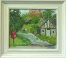 Load image into Gallery viewer, 10 x 12 inch oil painting of the door end of the village hall, with a track to some houses and a red post box on the verge in the left foreground. Also shows the cream coloured frame.
