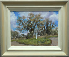 Load image into Gallery viewer, 9 x 12 inch oil painting of an Oak tree in early spring on the junction of Wing, Glaston and Morcott roads, witha lot of feathery branches and the white signpost on the grass verge in the centre, showing hand-finished grey outer to beige and off-white inner frame
