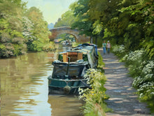 Load image into Gallery viewer, 9 x 12 inch oil painting of narrowboats on the Oxford Canal at Braunston, near Daventry., with a hump-back bridge in the middle distance, trees on the far bank, and overhanging trees on the right where the towpath takes the eye alongside the boats.
