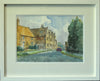 Pen and wash 10 x 14 inch watercolour of the Manor House in Preston, Rutland, by Alan Oliver, depicting an ironstone cottage on the left, with the Manor House in the centre of the painting, with dark evergreen trees on the right. Framed in a white frame, with double cream/white mount, behind glass.