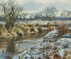 A bend in the River Welland at Duddington, with snow on the foreground bank and s skyline of distant trees, and a Hawthorn bush on the far riverbank on the left.