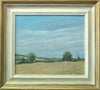 12 x 14 inch oil painting of a stubble field at Lyndon, with two Oak trees left and right, and a perfect blue sky. Also shows the buff coloured frame with gold-painted outer edge.