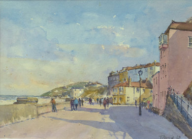 10 x 13.75 inch watercolour of the promenade at Cromer, with many figures strolling along, the sea in the left distance, cliffs in the centre and buildings on the right.