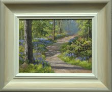 Load image into Gallery viewer, 6 x 8 inch oil painting of a curling path at wakerley Wood, with Bluebells abounding on both sides, showing hand-finished grey outer to beige and off-white inner frame
