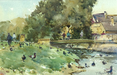 6.5 x 10 inch watercolour of the River Welland by a footbridge on Stamford Meadows, with stone buildings on the right, mature trees above the bridge, many figures milling about and lots of ducks on the gras and in the water.