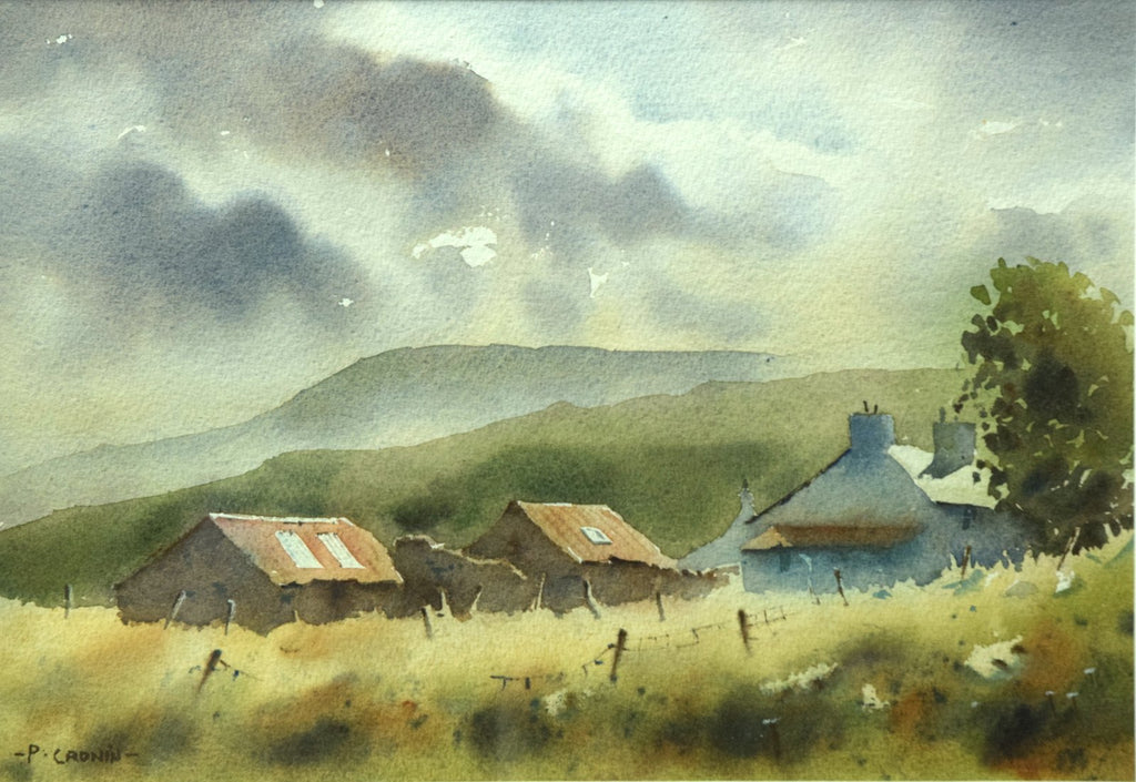 A 9 x 13 inch watercolour of Cuaig, near Applecross in the Highlands, featuring a farmhouse on the right and two iron-roofed barns, with mountains in the distance against a moody sky, and a wet-in-wet straw-coloured foreground with some fenceposts.