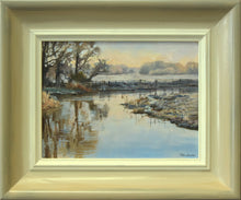 Load image into Gallery viewer, Small 6 x 8 inch oil of the river Nene at Castor, painted loosely, with distant trees, bank of nearer trees on the left and frosted grass, with reflections of the trees and clear sky in the water, also shows the frame with a greyish outer edge, gradating to the off-white inner edge.
