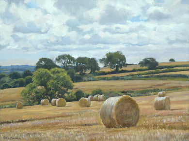9 x 12 inch oil of round bales of straw on a hill sloping down from right to left, with distant trees and some nearer trees in the middle distance.