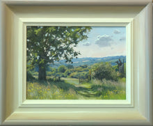 Load image into Gallery viewer, 6 x 8 inch oil of Haymeadows at Wing, looking downhill, with distant blue hills, a mature Oak tree in the left foreground and an open gate beyond. Shows hand-finished frame, with gradated colours from off-white inner to beige/grey outer.

