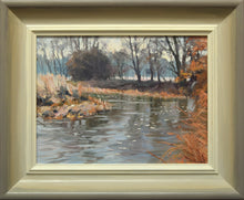 Load image into Gallery viewer, Small painting of the river welland on a bend at Harringworth, with loosely painted backdrop of trees, reflected in the fast-moving water. Shows the hand-finished frame with darker outer edge, gradating to off-white inner edge.

