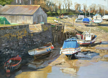 Load image into Gallery viewer, 10 x 14 inch oil painting of boats at Porlock Weir, with a barn and the harbour wall on left, with boats arranged around the foreground and middle-distance. Sunlit mudbank from the bright sunlight from our left and behind. Framed with a wide plain cream inner slip frasme and a thin, charcoal outer moulding.

