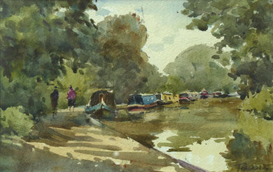 6.5 x 10 inch watercolour of the canal at Braunston, with several narrowboats moored along the towpah which curves from the front left of the picture, curving around to the distant trees on the right. 