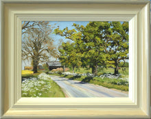 Load image into Gallery viewer, 10 x 14 inch painting of a lane leading to some barns, each verge adorned with Cow Parsley, and mature Oak trees in the far verge and a bare Ash tree on the left verge. Also shows the pale frame, with an off-white inner edge and a greyish outer edge.

