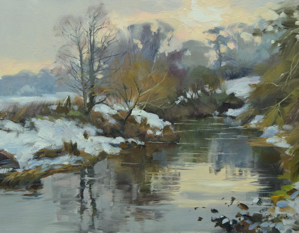 7 x 9 inch oil painting, of snow on the banks of the River Welland, with a backdrop of blueish trees, with larger trees in the middle distance and left foreground, painted in a looser style than Peter usually does, strong reflections in the water.