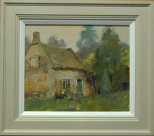 Load image into Gallery viewer, Oil painting of the old Bothy at Lyndon, painted in dull light, with beautifully subdued colours and tones, making the very best of the weather. The ancient stone of the cottage is painted in warm tones and the surrounding trees on the right and behind painted in receding tones of green and blue. Photo shows the stone-coloured frame with a white inner slip.
