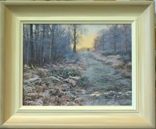 Load image into Gallery viewer, 7.5 x 10 inch oil painting of a deer hide at the top of a frosty ride through the wood, with an orangey sky. showinghand-finished frame with off-white inner, gradating to beige and grey outer frame.
