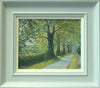 8 x 10 inch oil painting of the downhill road out of Lyndon towards Wing, through an avenue of Oak trees, showing the plain grey frame with off-white inner slip.