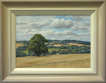 Load image into Gallery viewer, 10 x 14 inch oil painting of the freshly harvested cornfield, with a large Oak tree in the middle distance, and distant blue trees and a few houses of Wing in the far distance. Shows buff-coloured hand-finished frame with grey outer edge and off-white inner slip
