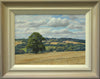 10 x 14 inch oil painting of the freshly harvested cornfield, with a large Oak tree in the middle distance, and distant blue trees and a few houses of Wing in the far distance. Shows buff-coloured hand-finished frame with grey outer edge and off-white inner slip