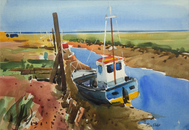 10 x 14 inch watercolour of boats moored at Thornham Norfolk, with a blue sky top third of painting. Colourful blue-hulled boat with yellow bottom and white wheelhouse, framed with a double cream mount and a black frame moulding