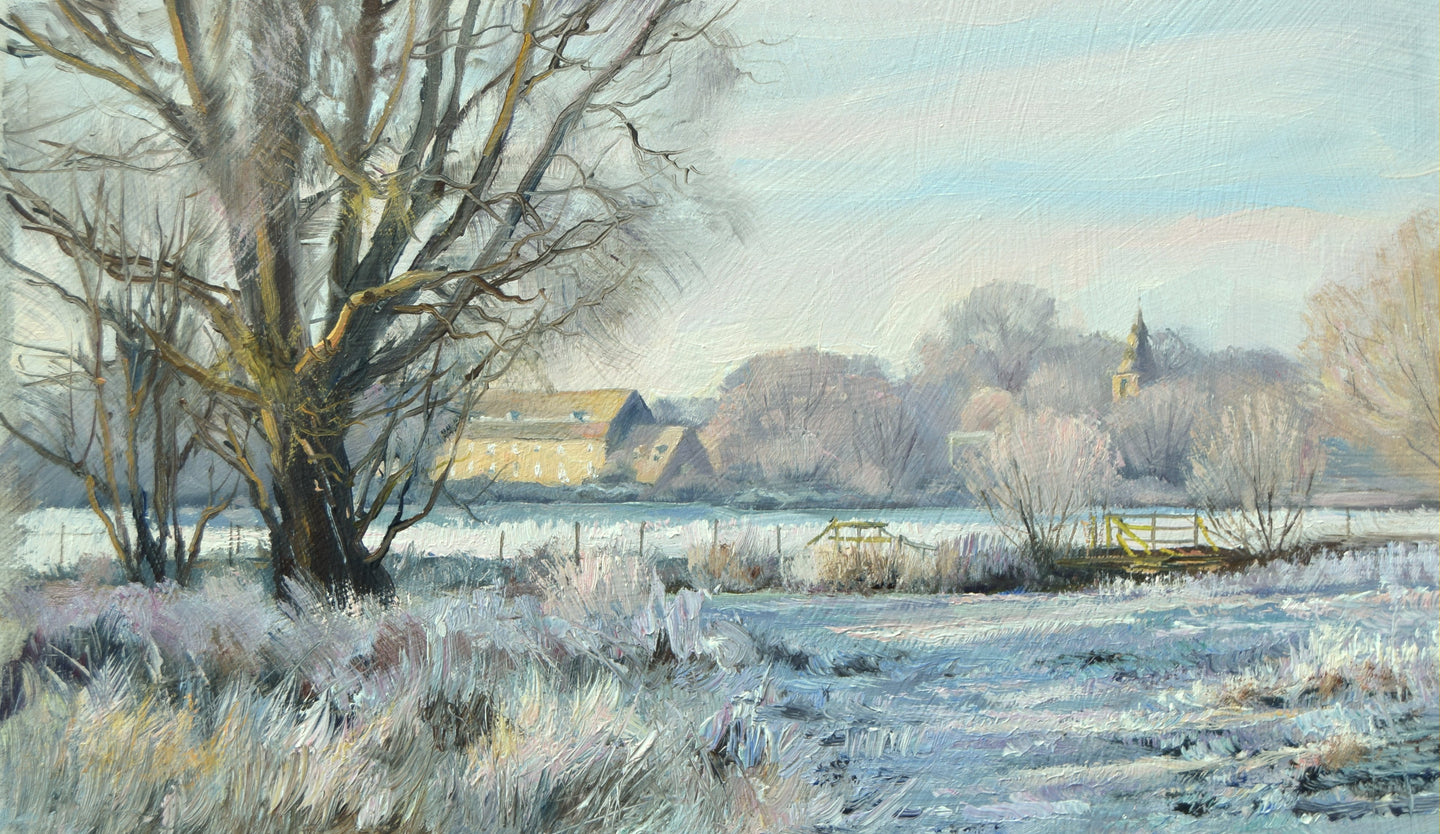 Frosty landscape with Water Newton mill and church in the distance, with bright, sunny sky, with a large foreground Willow ans tufted of frosted grass in the foreground.