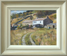 Load image into Gallery viewer, 9 x 12 inch oil painting of a white-painted farmhouse on a hill, with a stone barn alongside it, with a track leading through rough grassland up to it. Fresh washing is on the line. Shows the gradated-coloured frame, with an off-white inner edge to grey outer edge.
