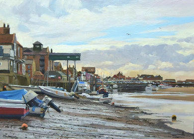 10 x 14 inch oil of Wells in Norfolk, with the iconic gantry and several other buildings and various boats on the mud at low tide.