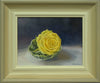 Painting of the head of a yellow rose, sitting in water in a cabbage-leaf dish on a white cloth and a dark, blueish background, with gradated grey to off-white inner frame