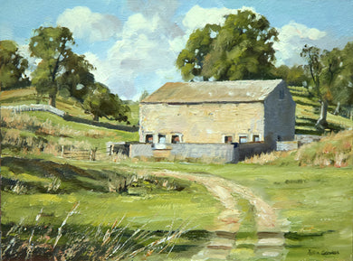 A small 6 x 8 inch oil of a barn on a hill, lit on its forward-facing long side, the right-hand end in shadow, several mature trees to the left and behind the barn, with a track running up yo it from the right foreground