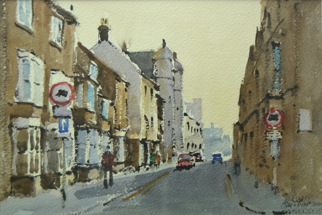 Watercolour of High Street West in Uppingham, looking towards the school with shopfronts on the left, by Alan Oliver
