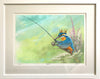Digital painting of a Kingfisher wearing a gold crown, holding a fishing rod, framed with a white frame moulding and white mount with glass