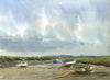 Several boats on the mud at Morston, with the creek at low tide, cloudy sky with Blakeney in the distance