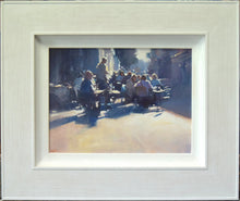 Load image into Gallery viewer, 9 x 12 inch acrylic painting by Carl Knibb, depicting lots of people outside a street cafe, sitting on tables, enjoying a chat over lunch, again looking into the sunlight, with strong, blue shadows cast on the pavement around them. Shows whitewashed frame.
