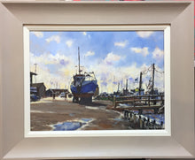 Load image into Gallery viewer, Oil painting by Terry Preen of Southwold harbour featuring a prominent blue boat, framed in grey with cream slip 
