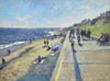 Oil painting of people walking along Southwold's promenade with buildings top right above steep grassy bank and people on beach