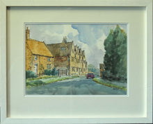 Load image into Gallery viewer, Pen and wash 10 x 14 inch watercolour of the Manor House in Preston, Rutland, by Alan Oliver, depicting an ironstone cottage on the left, with the Manor House in the centre of the painting, with dark evergreen trees on the right. Framed in a white frame, with double cream/white mount, behind glass.
