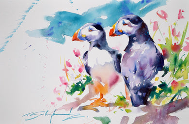Close-up watercolour painting of a pair of Puffins standing in grass with wildflowers, by Tom Shepherd, unframed size 14 x 21 21.5