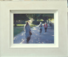 Load image into Gallery viewer, 9 x 12 inch acrylic painting by Carl Knibb, with figures walking in a park, dappled sunlight throwing spots of sunlight on the path, as the title suggests, with edges of the figures lit-up. Shows whitewashed frame.
