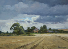 Load image into Gallery viewer, Small oi painting of a farmstead near Caldecott, dark stormy sky and partly sunlit stubble field, by Peter Barker
